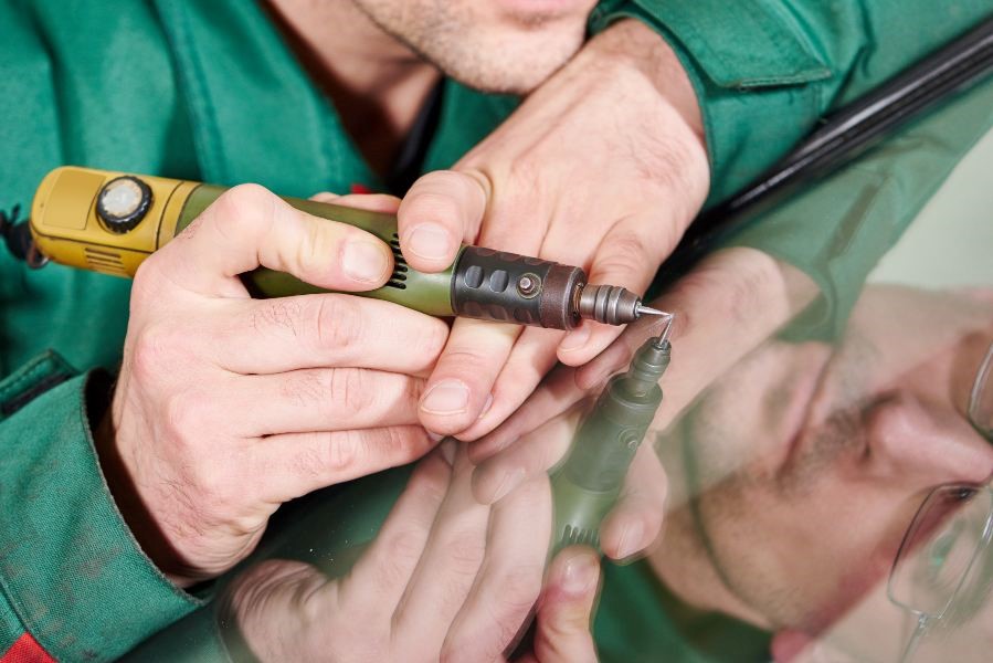 A person holding a drill